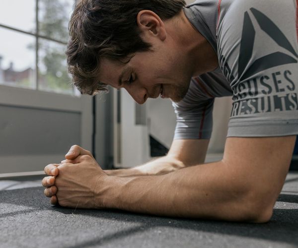 Strong man demonstrating stability and focus during practice